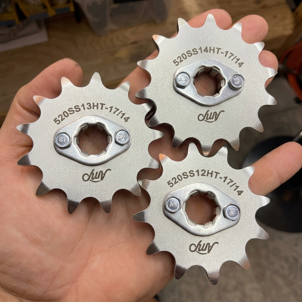 Amp QS 138 V3 520 tuning pack sprockets held in hand for scale